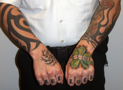 So besides the neck tattoos the deputy also tattooed his knuckles and hands…