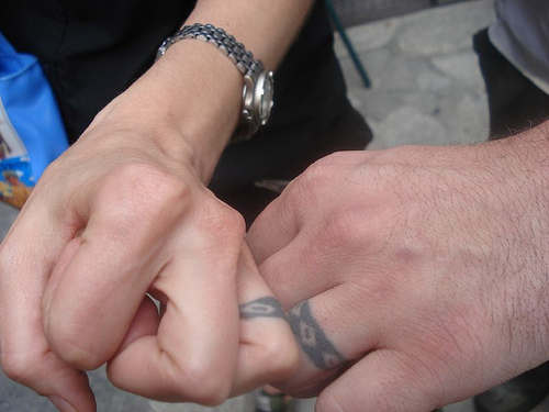 including birthdays and anniversaries, are common finger tattoos.